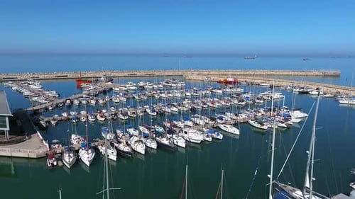 Boats and small sailing Yachts docked in a beautiful marina, Top down view