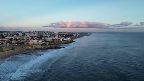 Flying over the shore of Portugal at sunset