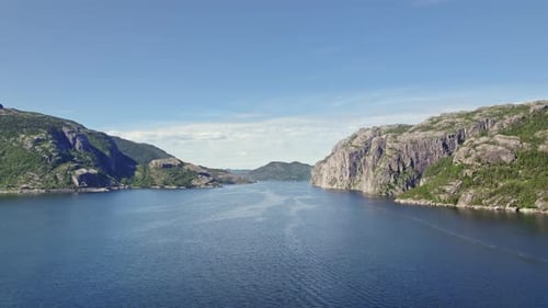 Aerial View Of Expansive River Surrounded By Norwegian Mountains