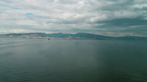 Izmir cityscape with clouds and sea