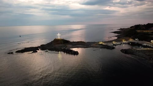 Aerial view of cross monument on rocky cape, Bulgaria.