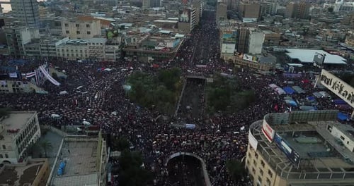 Aerial View of Massive Crowd Gathering in City