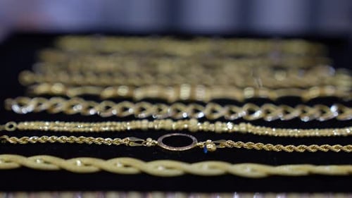 Luxury Gold Bracelet Collection Display on Black Background