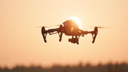Drone Flying at Sunset in Rural Landscape