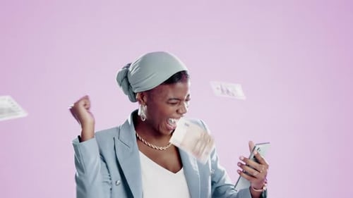 Thrilled Young Adult Wins While Using Smartphone