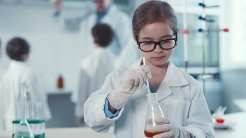 Girl Stirring Beaker in Brightly Lit Science Lab