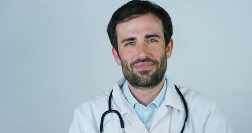 close up portrait of a surgeon or doctor with mask and headset ready for operation in hospital or