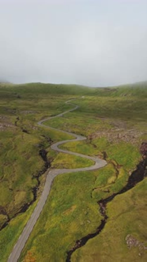 Aerial view of winding road, Faroe Islands.