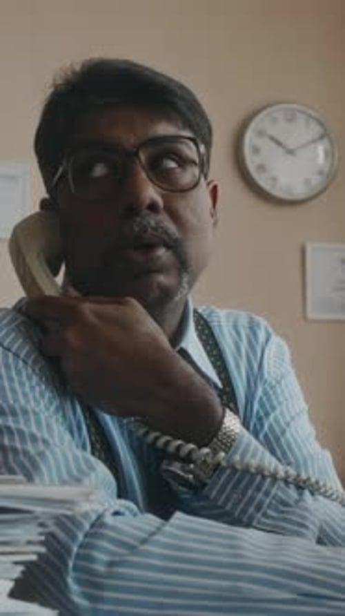 Vertical of Busy Office Worker during Workday in Vintage Office