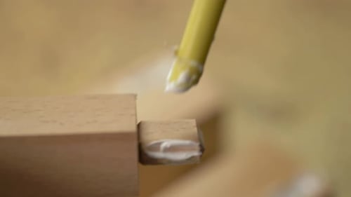 Applying Glue to Wood for Construction