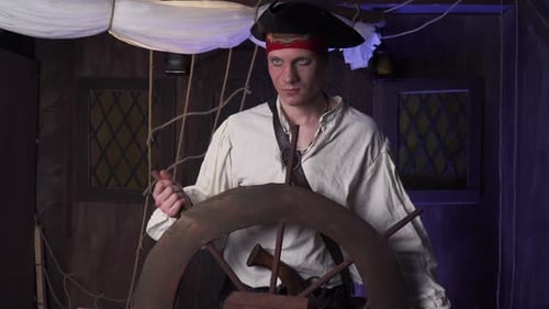 Pirate Captain at the Helm of His Ship