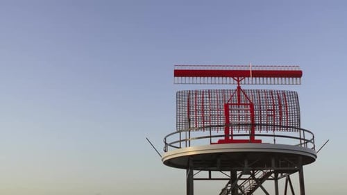 Spinning Radar Tower against a Clear Blue Sky