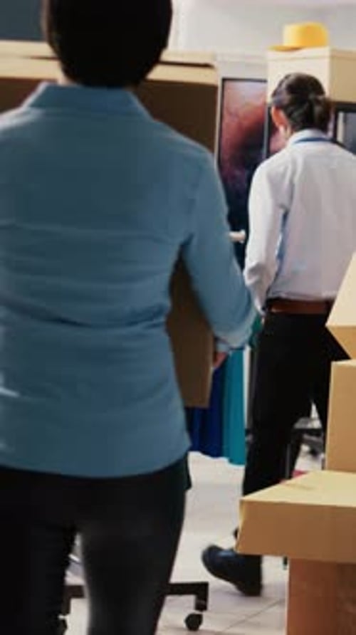 Store Workers Looking at Carton Boxes