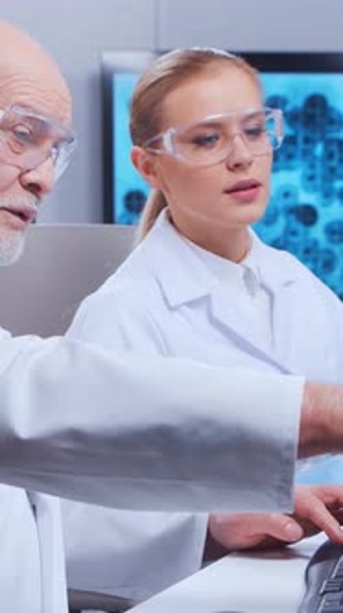 Scientists Analyzing Data in Laboratory Setting