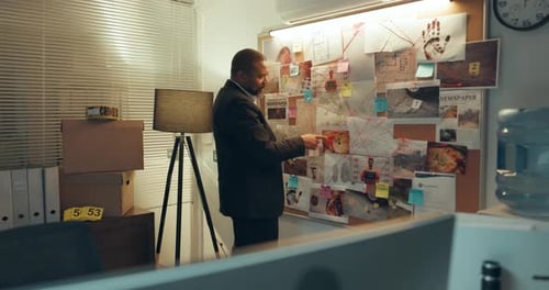 Man, crime board or night with private investigation for murder scene or tracking suspect in office