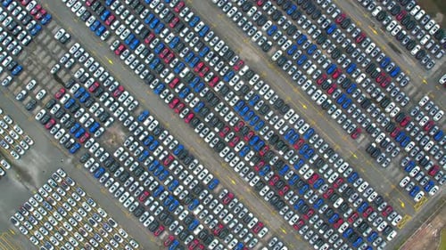 Aerial view from drones flying over a lot of cars