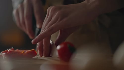 Slicing Fresh Vegetables, A Professional Cook Woman Of European Appearance Cuts Tomatoes