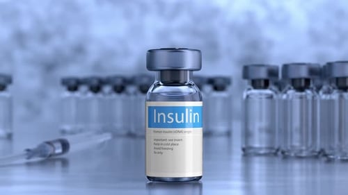 Insulin Vial and Syringe in Professional Medical Setting