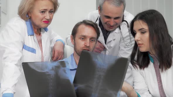Diverse Group of Doctors Analyzing Xray Scans with Focused Expressions ...