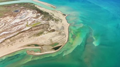 Stunning Aerial View of Turquoise Ocean and Sandy Coastline