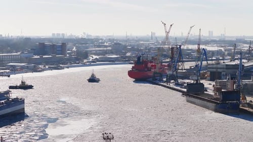 Aerial Riga Shipyard in Winter with Cranes Dry Docks and Vessels