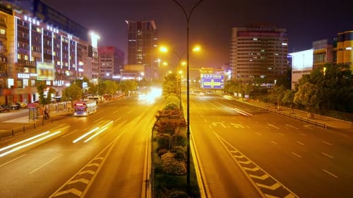 Timelapse of concept vehicles flowing through the glowing night streets of yiwu China
