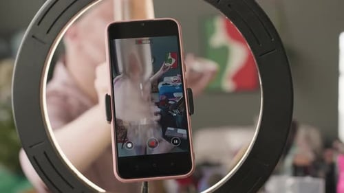 Queer Man Drinking Champagne and Vlogging at Home