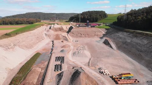 Trucks machine works in sand ballast quarry