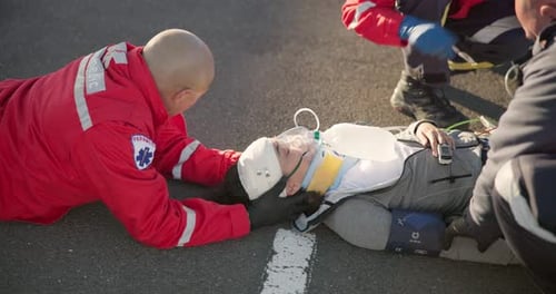 Emergency, healthcare and paramedic on road for injury, accident and car crash for saving patient