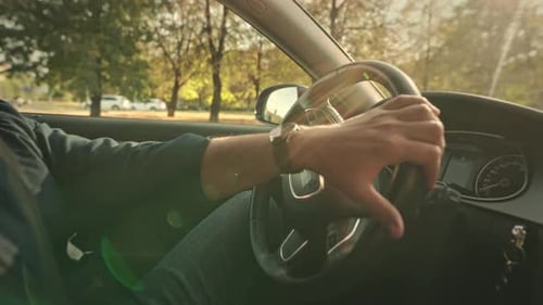 Driver Hands on Steering Wheel Driving in City