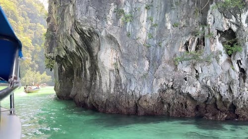 Holiday Thailand south island hopping limestone cliff view long tail boat