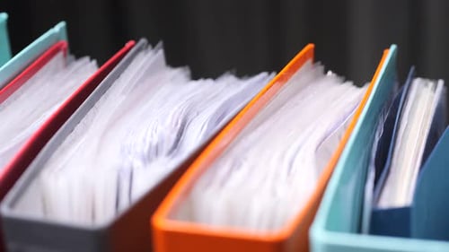 Closeup Colorful Binders Storing Important Documents Filling Office Shelf