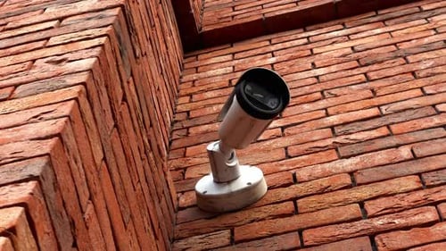 Surveillance at the Mall CCTV Camera on Building Wall