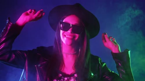 Stylish Rock Woman Dancing in Neon Multicolor Light