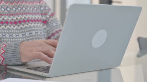 Close up of Man Typing on Laptop