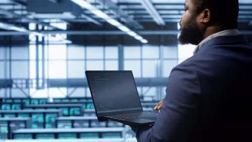 Admin in Data Center Running Error Checking Utilities on Tablet to Fix Hardware Bugs