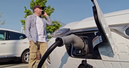 Electric Vehicle Charging Port Plugging in EV Modern Car