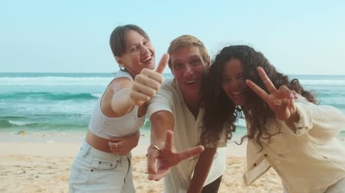 Young Cheerful Positive Friends Shout Joyfully Stands on Summer Sea Beach