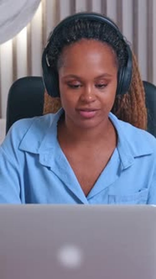 Woman Has Video Call On Laptop At Home