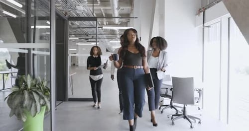 Business People Walking in Modern Office Corridor Business