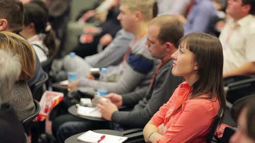 Audience Members Attending Conference Session Indoors