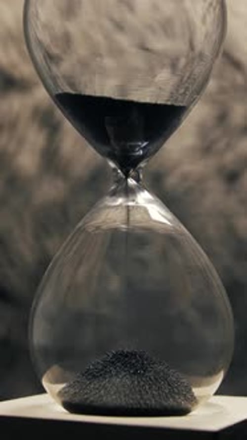 Hourglass Sand Flowing Down