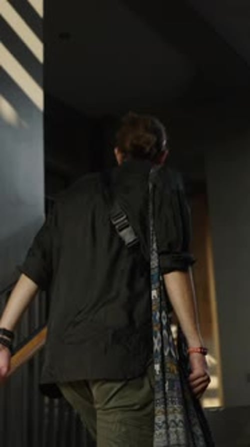 Young Adult Ascending Stairs in Urban Environment