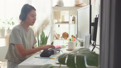 lady IT development programmer listen music enjoy work type on keyboard coding programming.