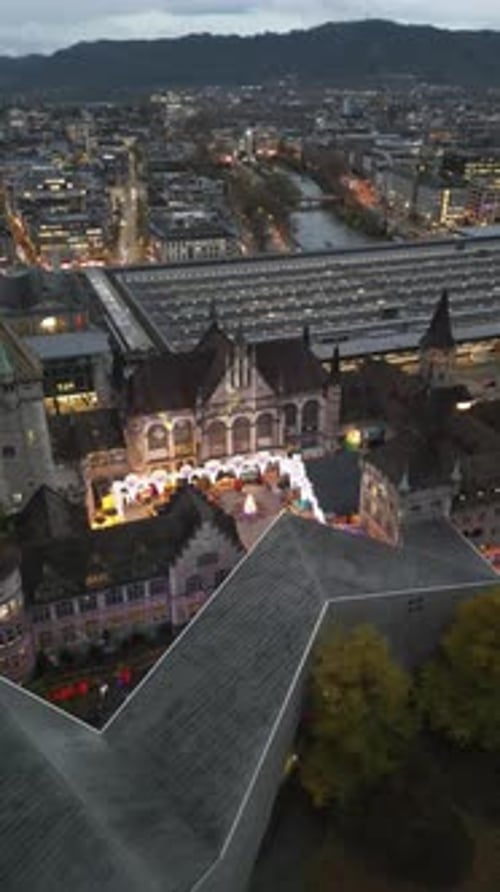 Aerial video of the Swiss National Museum with the city of Zurich, Switzerland in the background