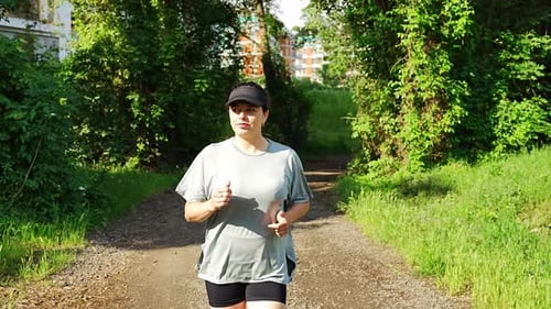 Young Woman Runner Training in Summer Park Close Up Fitness Woman Jogging Outdoor Morning Running