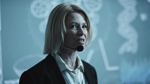 Woman Giving Tech Presentation in Corporate Setting