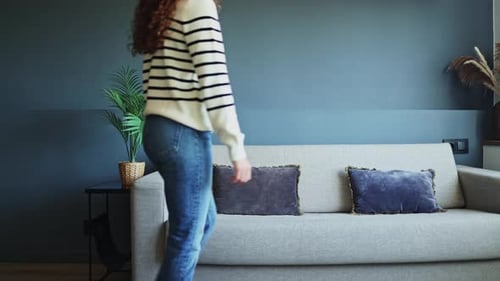 Woman Lies Down on Sofa for a Rest
