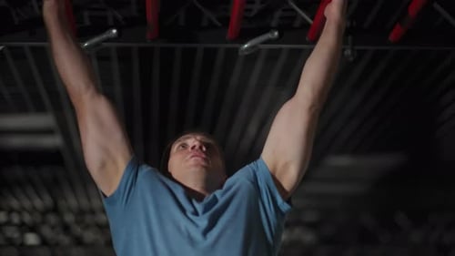 A Man Pulls Himself Up on a Special Ladder Closeup Slow Motion
