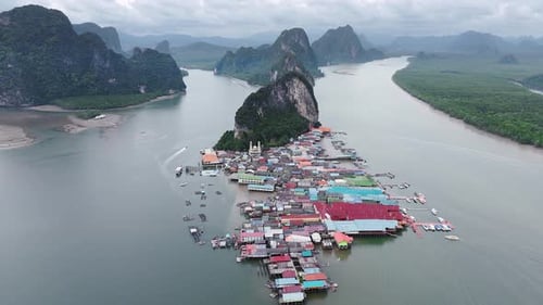 Aerial footage of Ko Panyi, a floating village in Thailand, showcasing its unique architecture and s